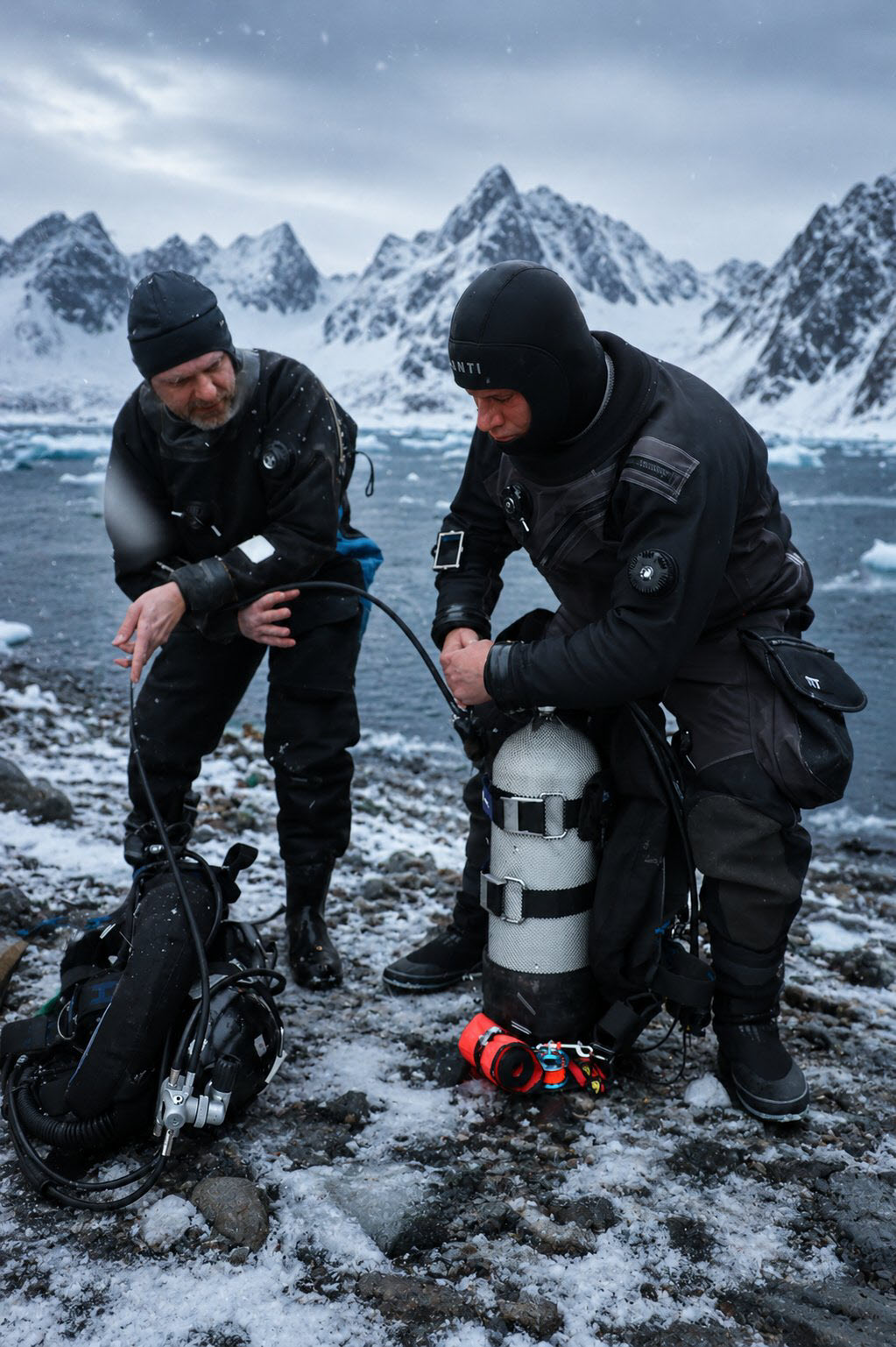 Cold-water diver in drysuit preparing for polar expedition