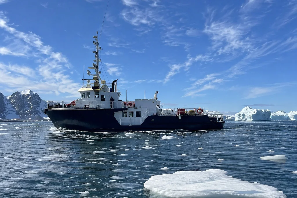 A Seven Oceans Expeditions vessel at anchor in Arctic waters